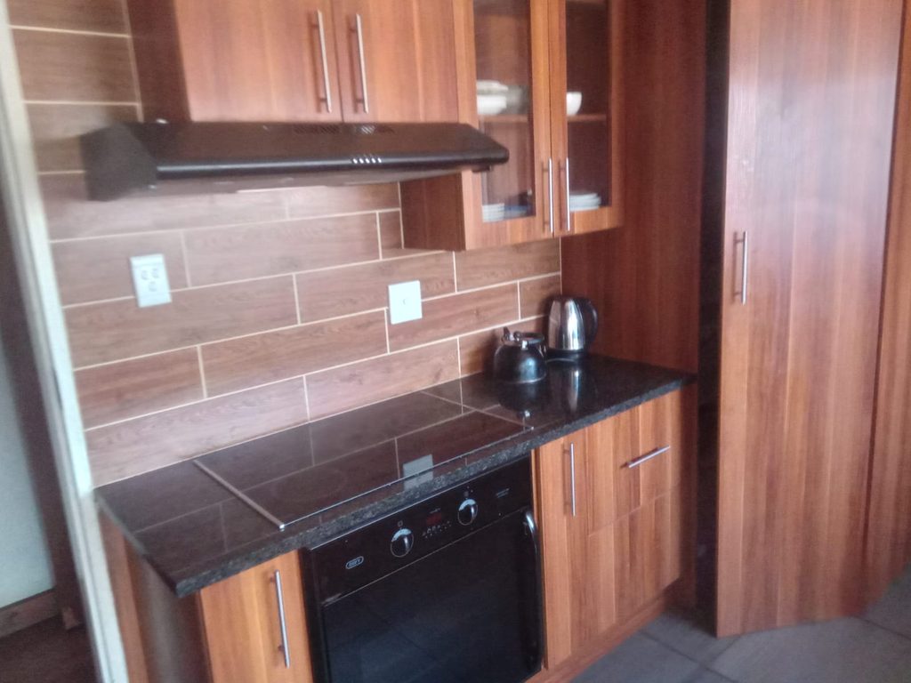 4 BEDROOM FAMILY HOME FOR SALE IN RHODESFIELD, KEMPTON PARK – WITH INCOME-GENERATING COTTAGE, POOL & LAPA 1000408082